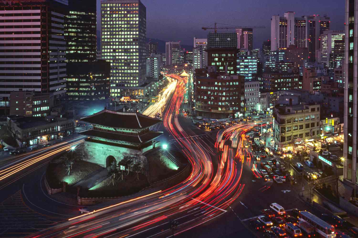 Traditional hanok rooftops in Seoul at sunrise, symbolizing farewell in South Korea tour package
