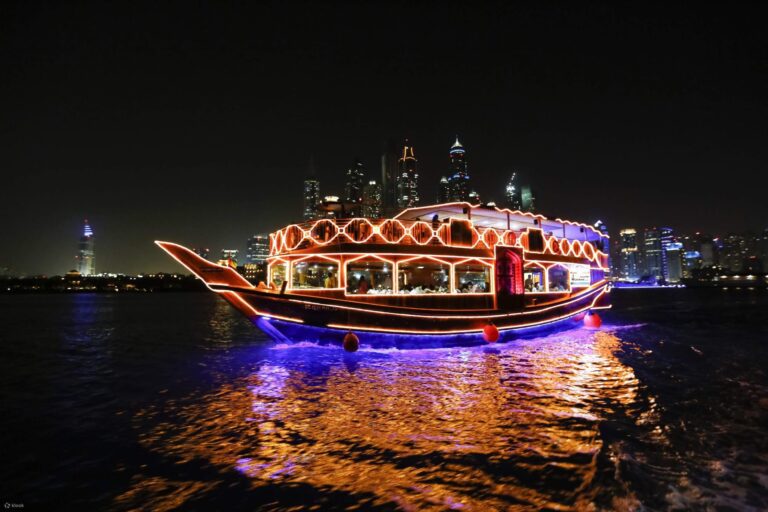 Dubai Creek Cruise boat with city skyline by Garnet Tourism.